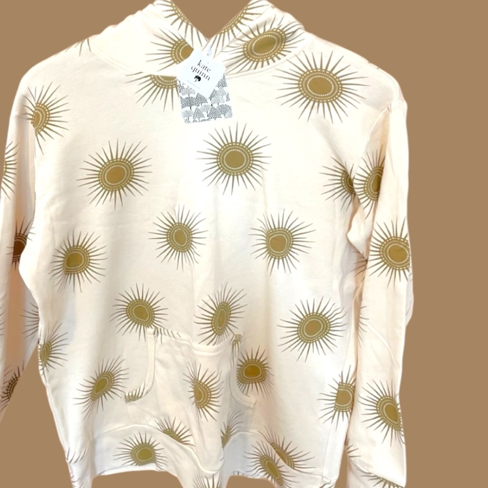 Kate Quinn Cream Hoodie with Gold Sunburst Pattern